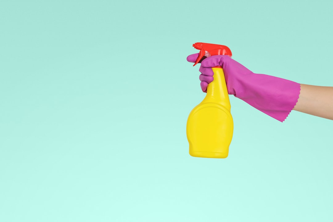 services-04 person-holding-yellow-plastic-spray-bottle-zmnefoi3k